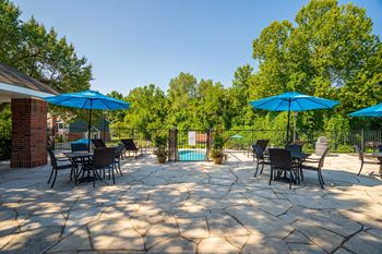 Sundeck Lounge Area With Tables & Umbrellas